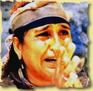 A kashmiri woman crying over her dead